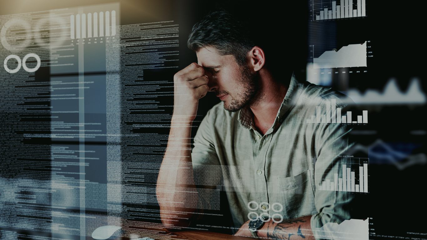 A frustrated commercial leader surrounded by data and dashboards